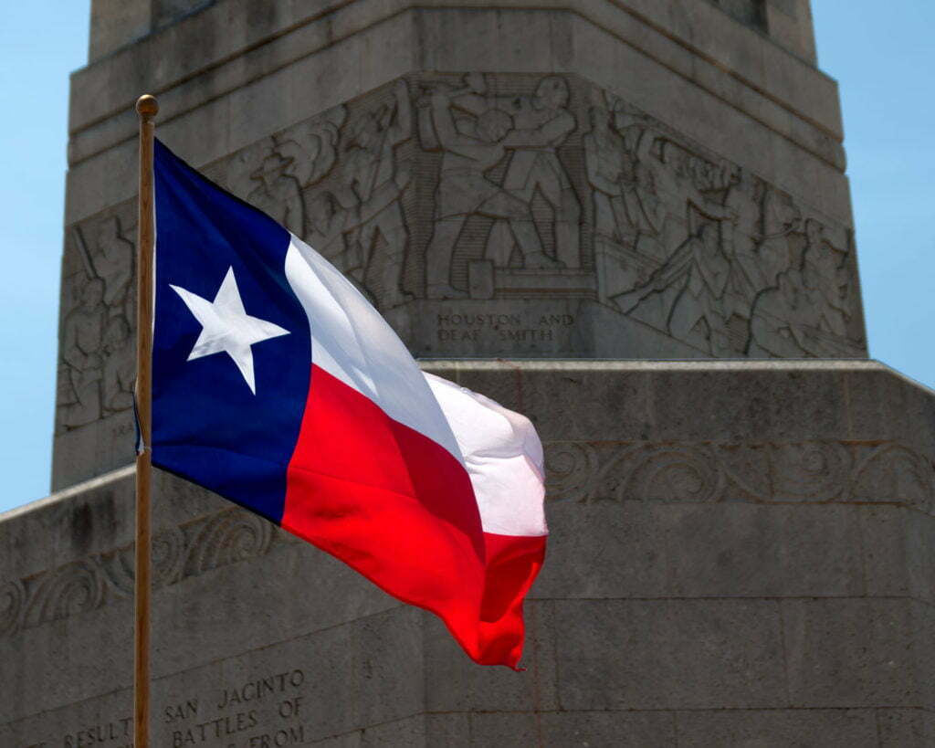 Texas flag in front of the San Jacinto Battleground monument near Houston, Texas
