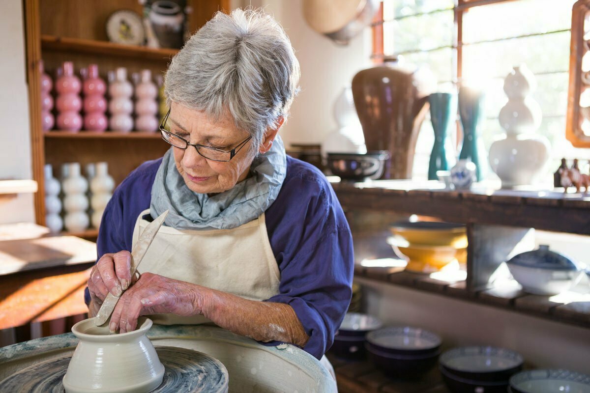 Senior woman taking a pottery class