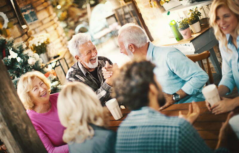 a group of seniors socializing at a senior living community