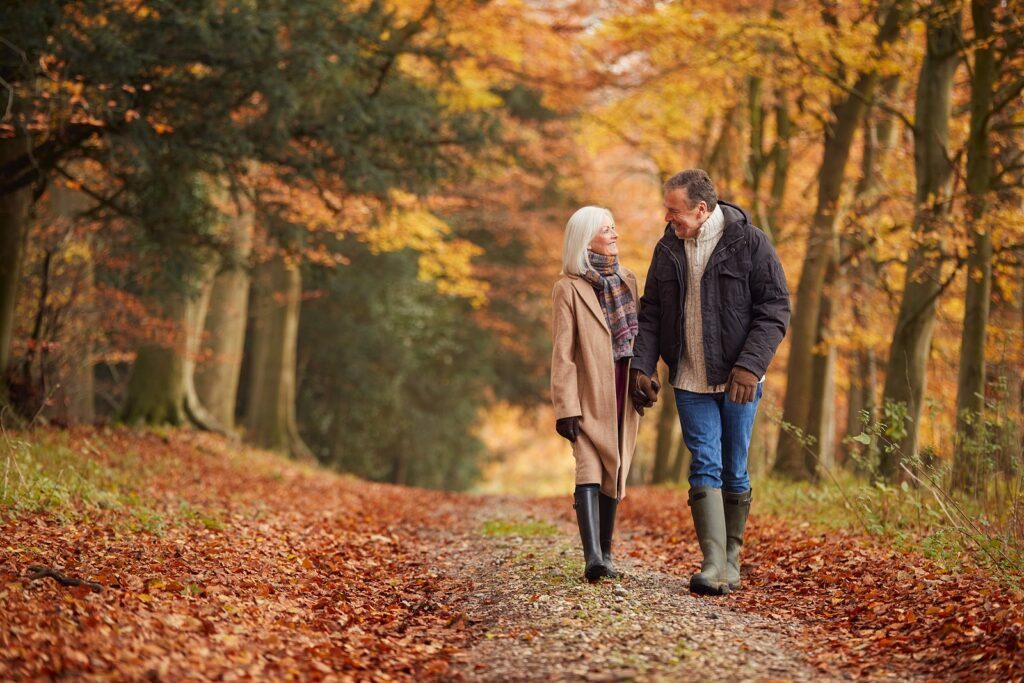 Senior couple enjoying a walk in autumn