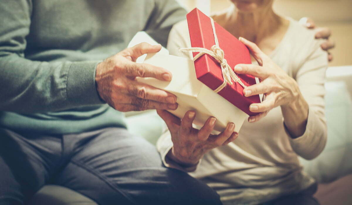 seniors opening a gift